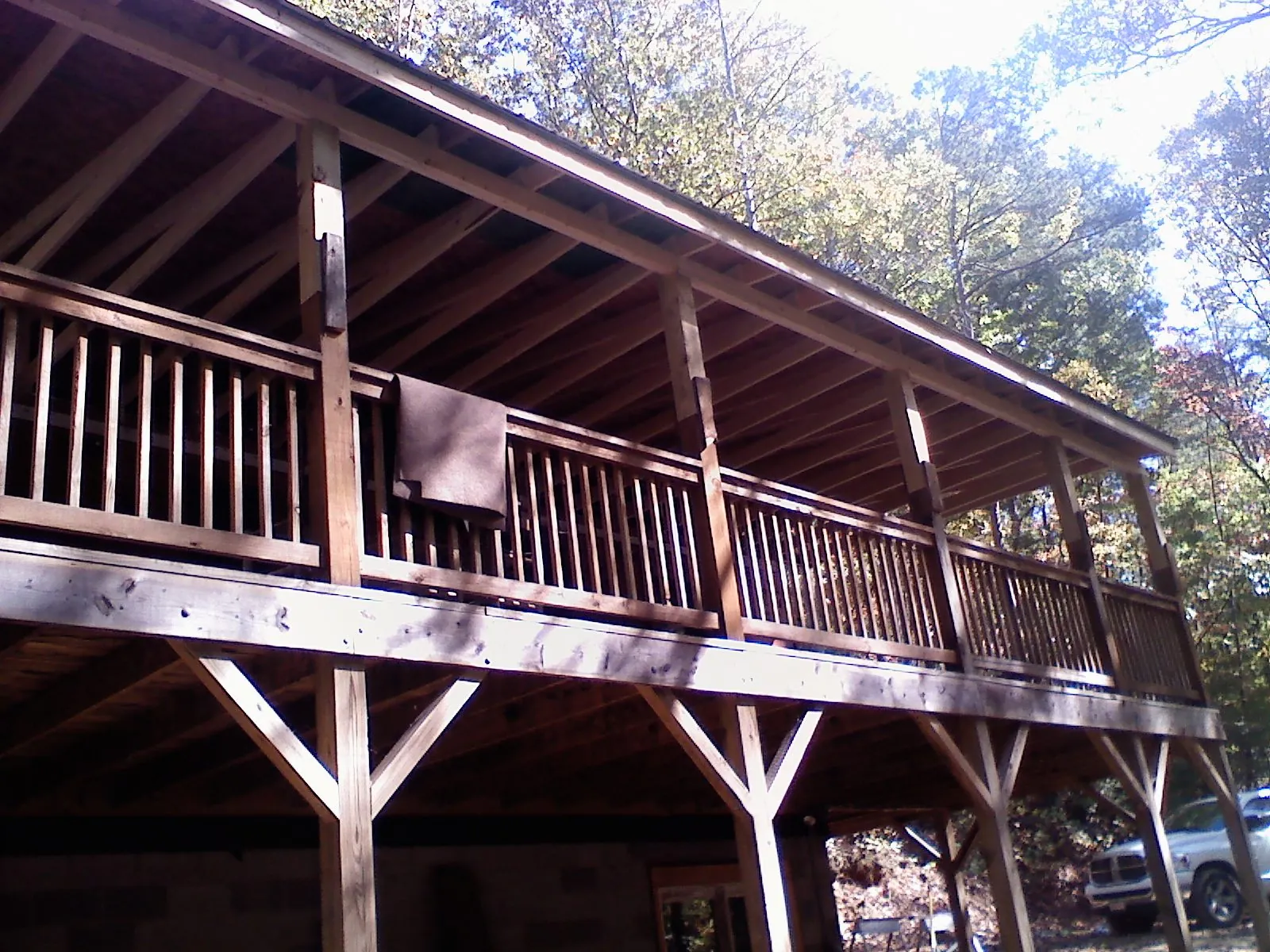 Timber framing under a new elevated porch and deck — Roof Leak Repair in West Baldwin by Roofing Brothers